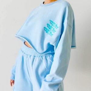 Mayfair Group “Chill Out” Light Blue Cropped Crew Neck Sweatshirt